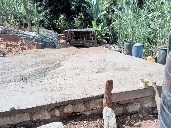 Toshe Ujenzi Works Limited concrete slab and stone retaining works on a project site