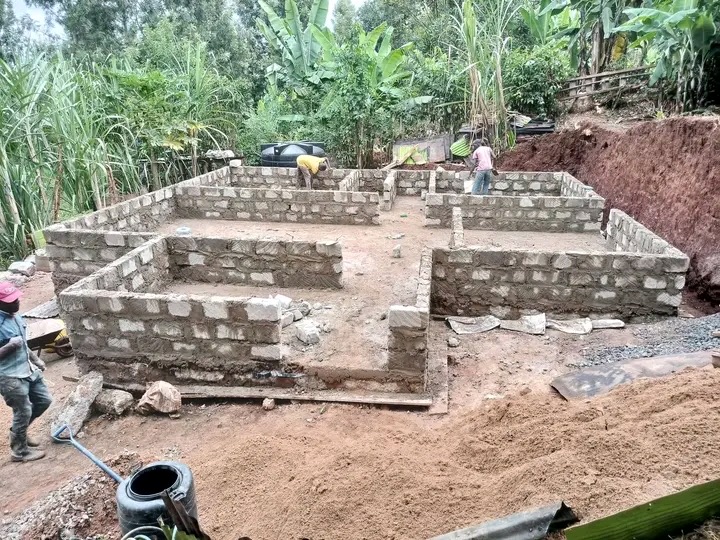 Toshe Ujenzi Works Limited masonry walls under construction with workers on site