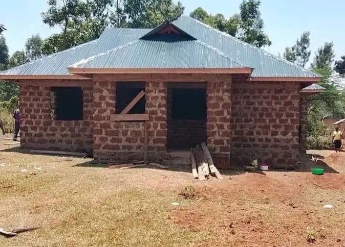 Toshe Ujenzi Works Limited stone building shell with roof installation completed